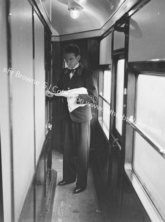 BUFFET CAR WAITER IN CORRIDOR